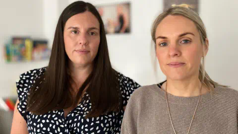 BBC Sisters Sarah Davies and Annika Thomas look towards the camera  